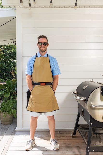 man-posing-with-grill-apron