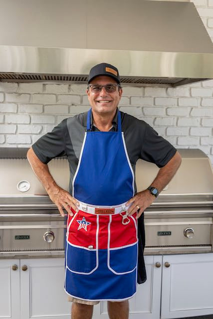 man -posing-in-grilling-apron